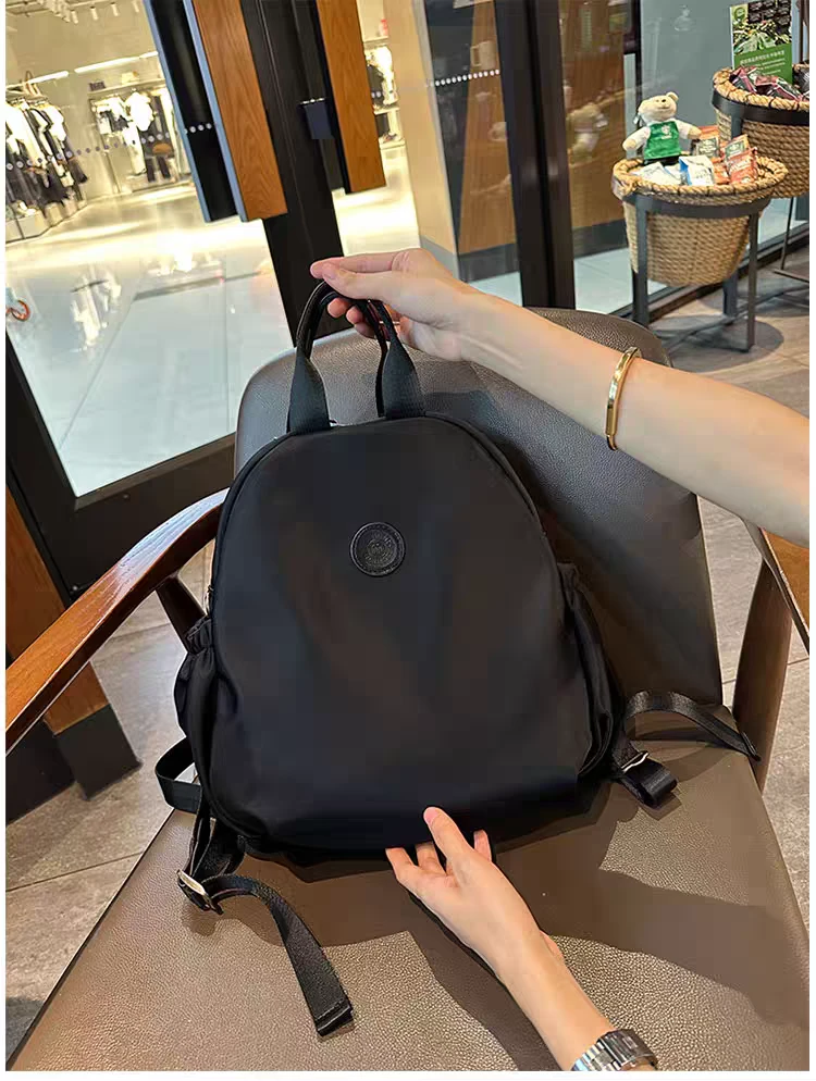 牛津帆布双肩包女士2024新款轻便时尚学生书包大容量防水旅行背包