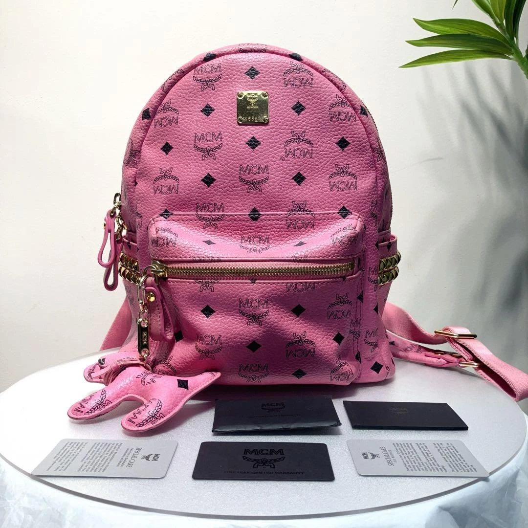 95新 MCM W MCM粉色老花铆钉双肩包小号31067253