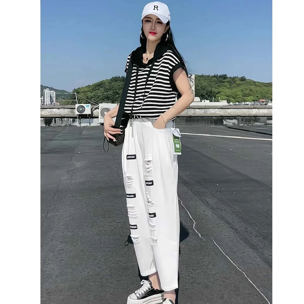 欧州站2025夏季新款个性破洞贴标洗水宽松牛仔哈伦裤女