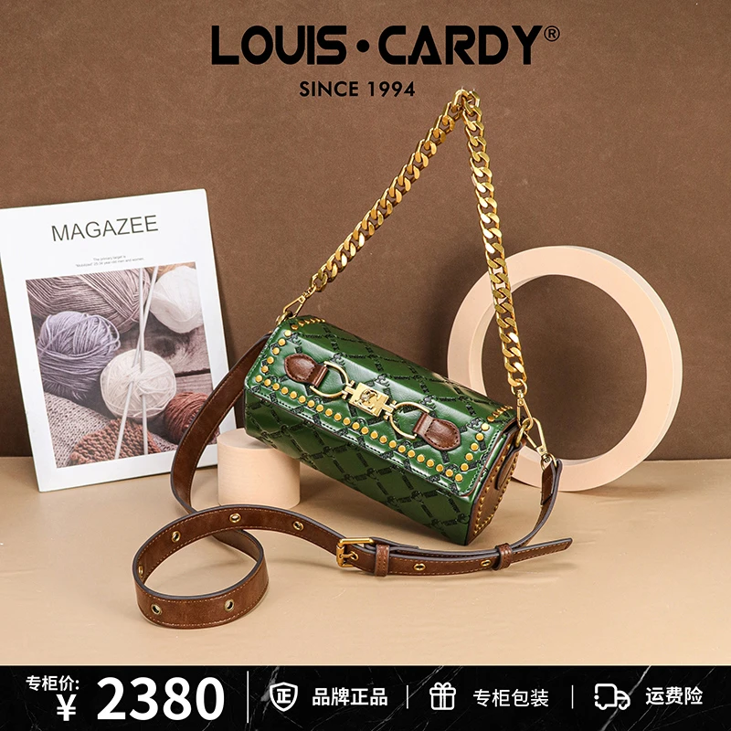 路易卡迪 六角型复古重工字母压纹铆钉斜挎盒子包