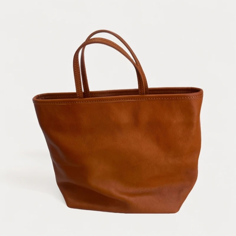 新款简约品质牛皮纯色竖款手提单肩挎休闲小众头层牛皮托特包