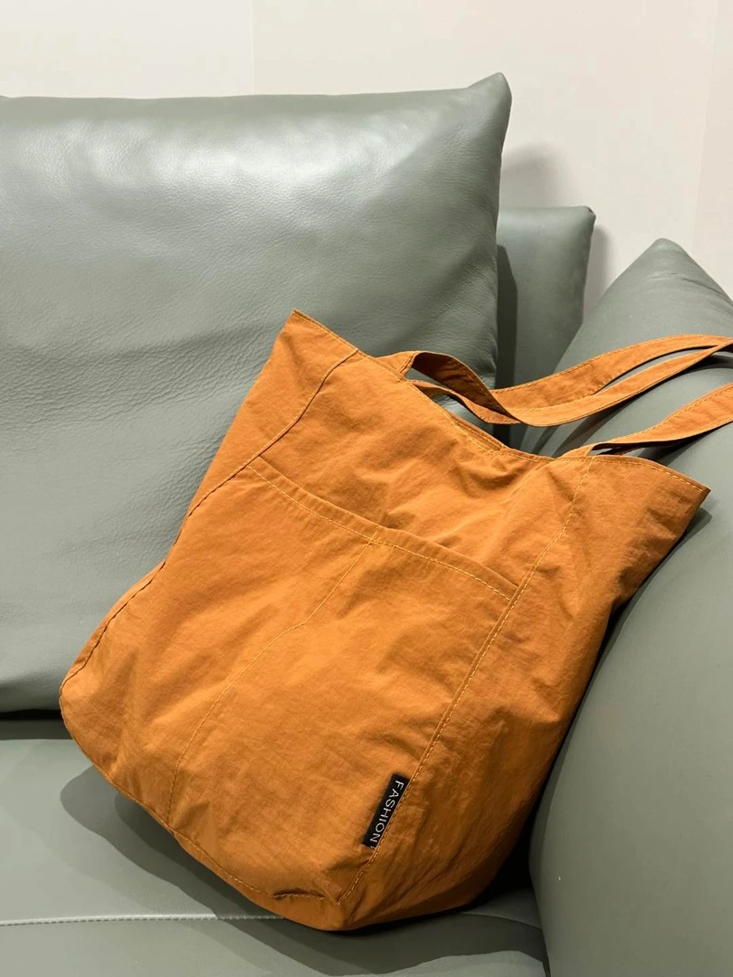 帆布包女日系防水尼龙休闲单肩布包设计感小众大容量通勤托特包