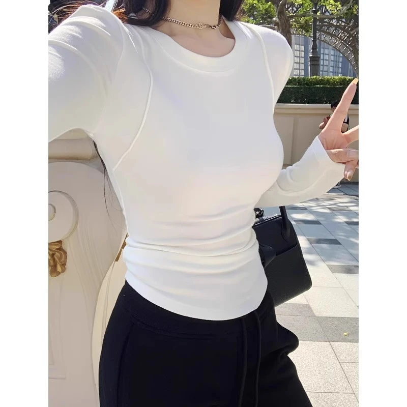 芯娇晴白色正肩长袖T恤女秋季辣妹修身不规则内搭圆领打底衫上衣