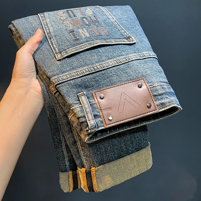 早秋新品牛仔裤男潮流绣花宽松弹力长裤复古蓝色锥形窄脚哈伦裤男