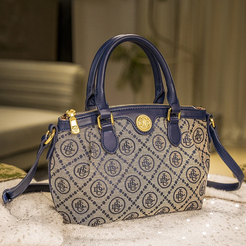 戈兰黛轻奢女包2025新款重工刺绣贝壳包百搭时尚手提单肩斜挎包