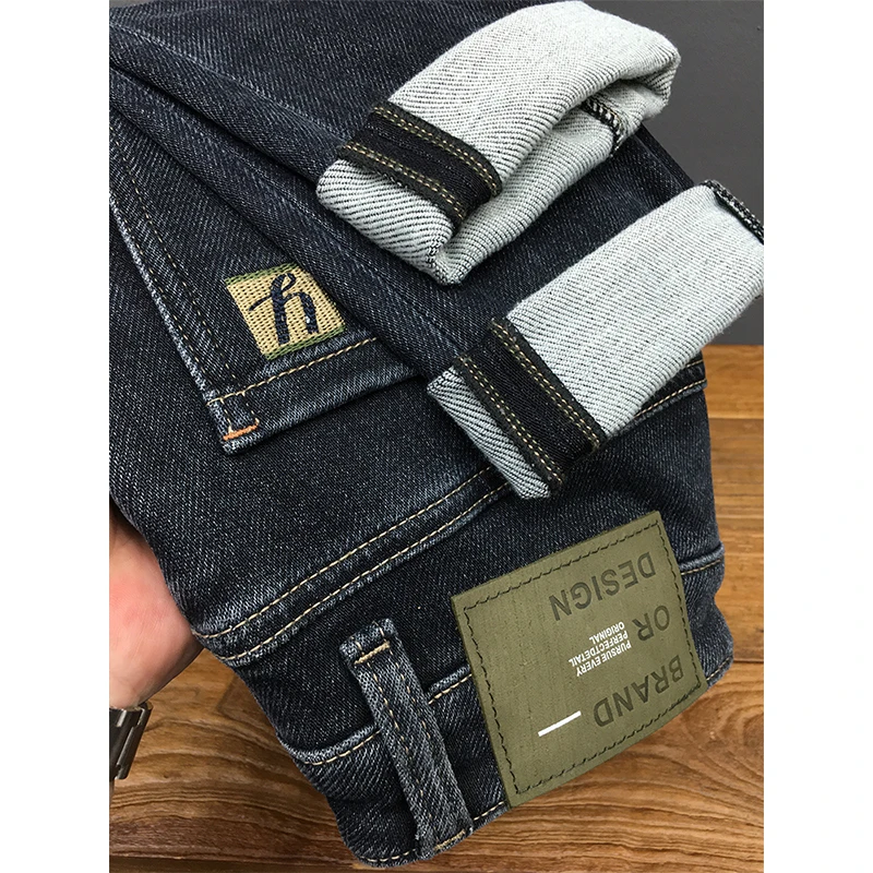 秋冬款牛仔裤男高端潮牌弹力深蓝色修身小脚印花刺绣长裤冬季