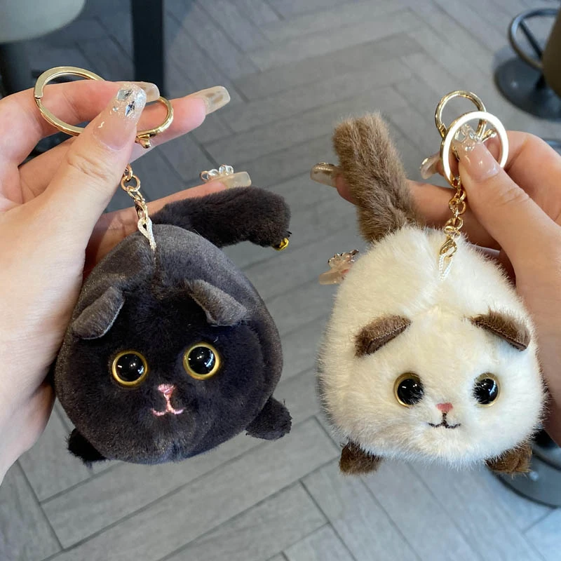 卡通可爱创意有趣的拉线会摇尾巴还会吱吱叫的小猫毛绒玩具