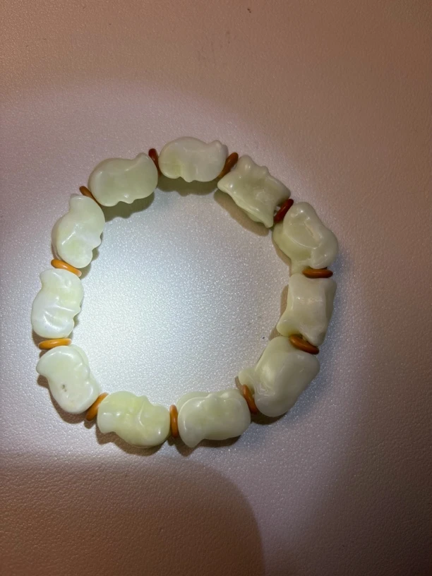 岫岩玉嘎嘎来财小手串