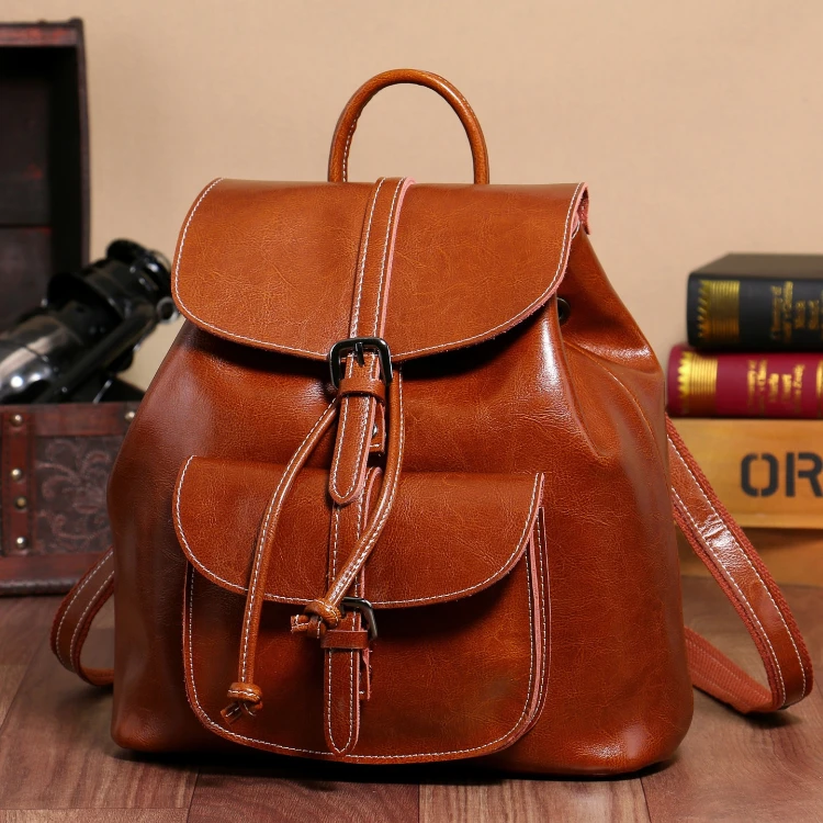 油蜡牛皮口袋双肩包时尚抽带收口翻盖韩版牛皮大包女包潮流学生