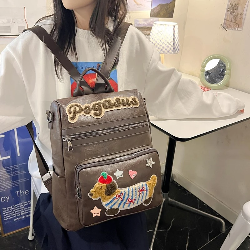 复古美式学院风大容量单肩双肩手提美拉德百搭腊肠狗笔记本背包包