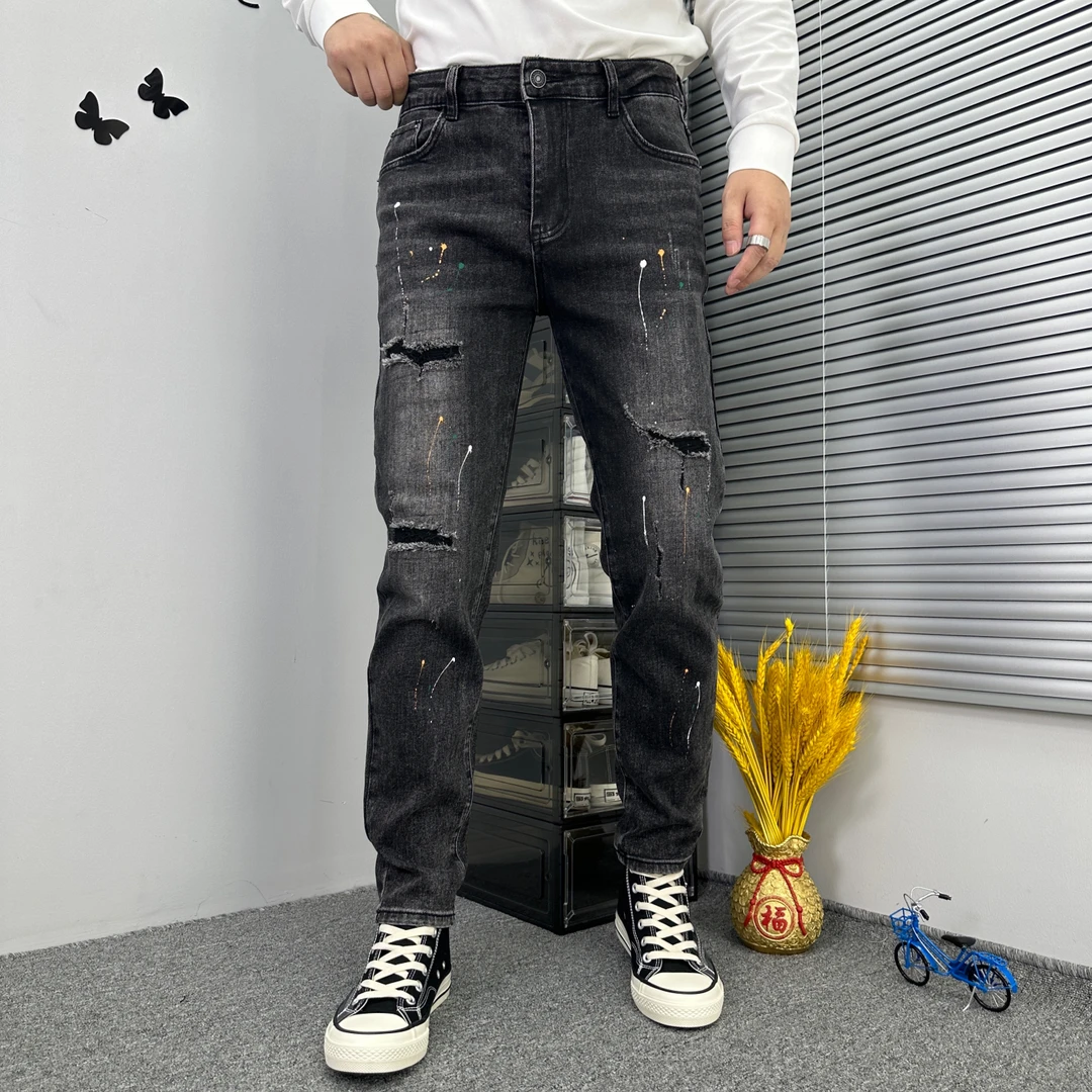 男士破洞补丁牛仔裤2024秋冬新款时尚个性泼墨弹力修身小脚裤长裤