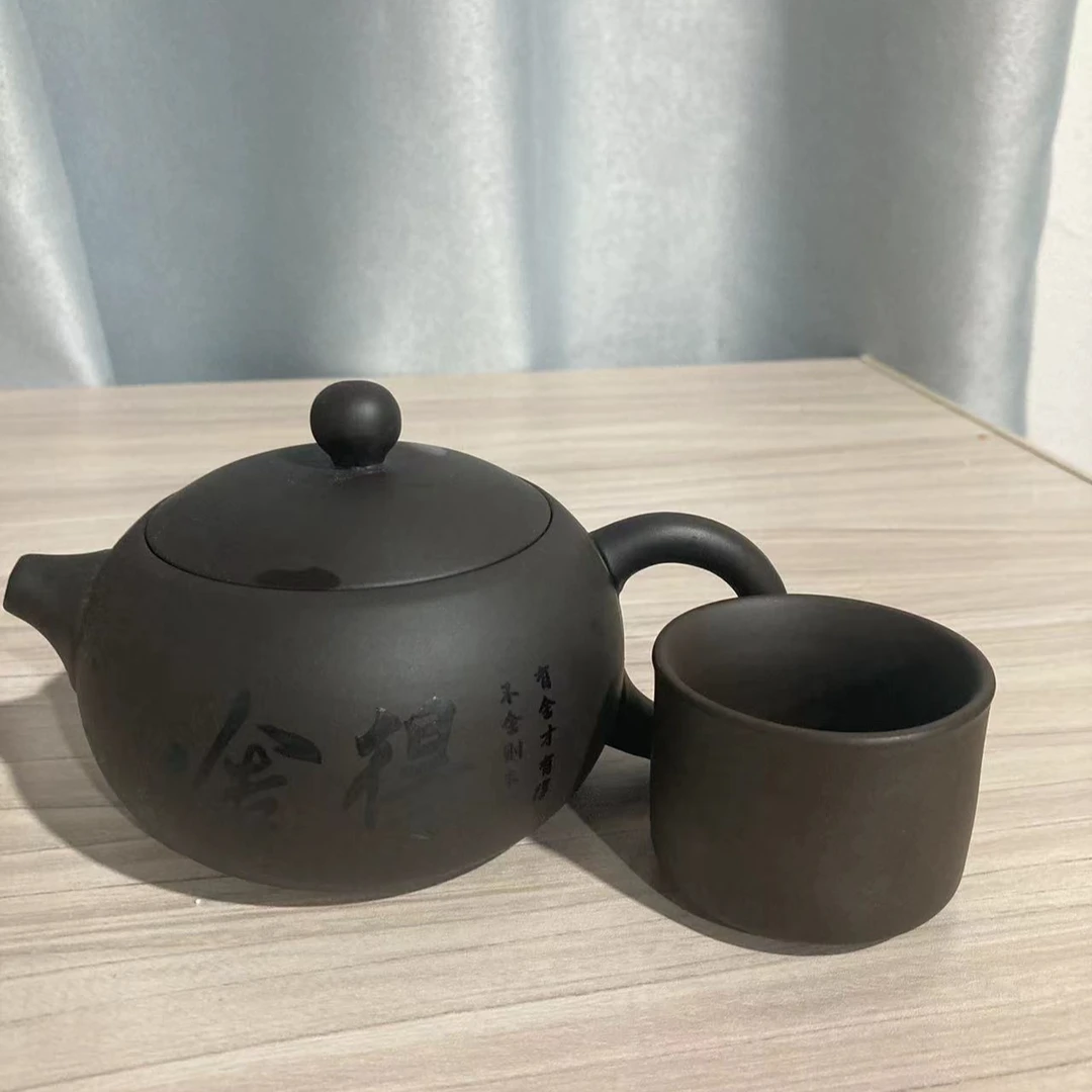 GF128紫砂乌泥茶壶舍得图案带一个茶杯