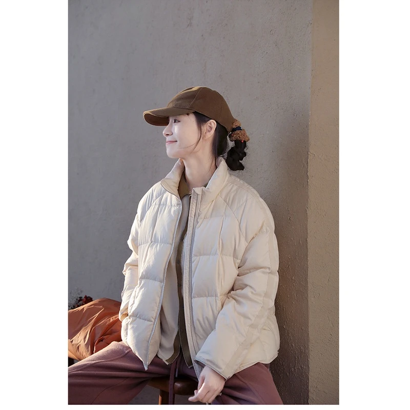 时尚休闲暖白色立领轻奢宽松加厚白鹅绒冬季短款保暖羽绒服棉衣女