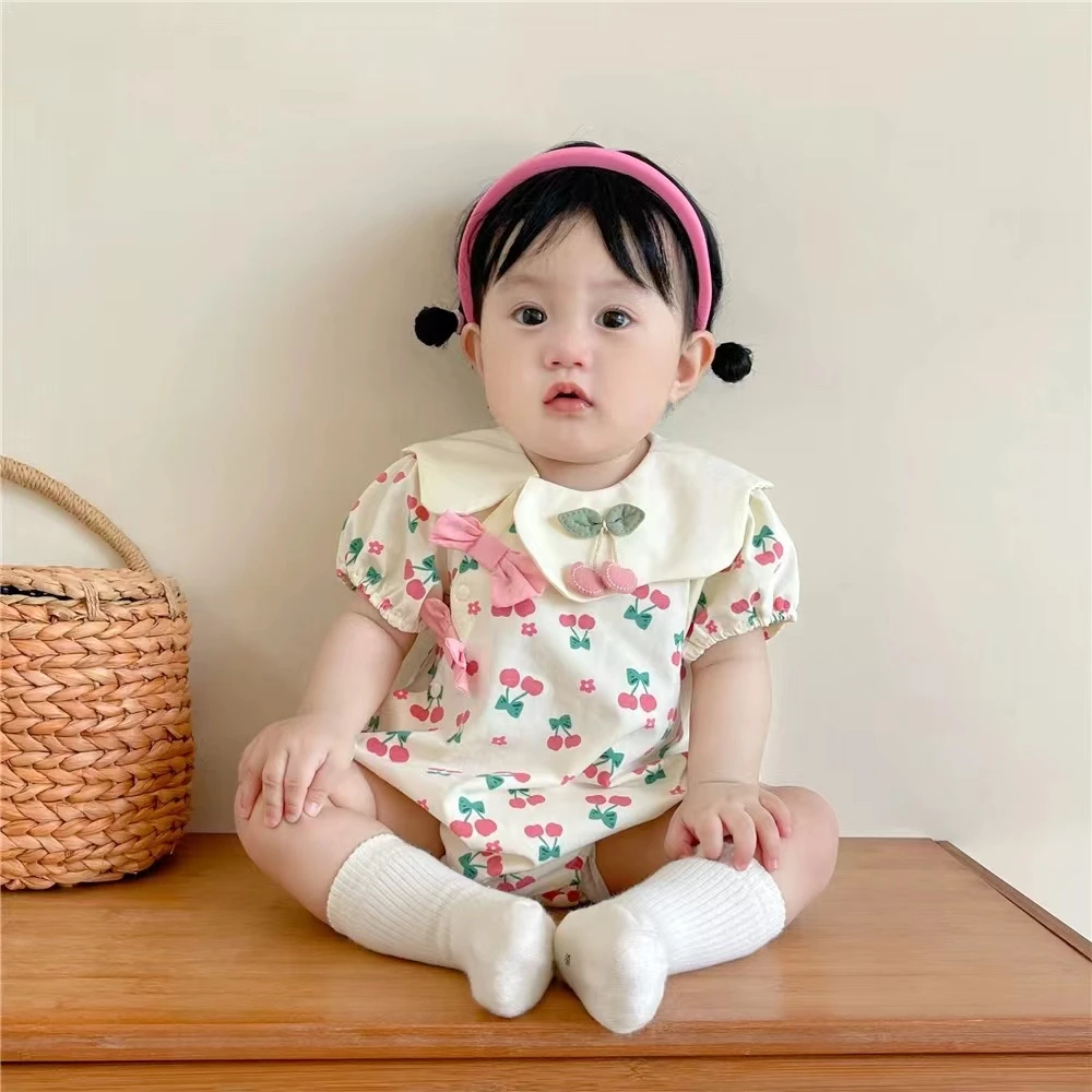 婴幼儿夏季新生儿女宝连体花瓣领蝴蝶结满印樱桃包屁连体衣爬爬服