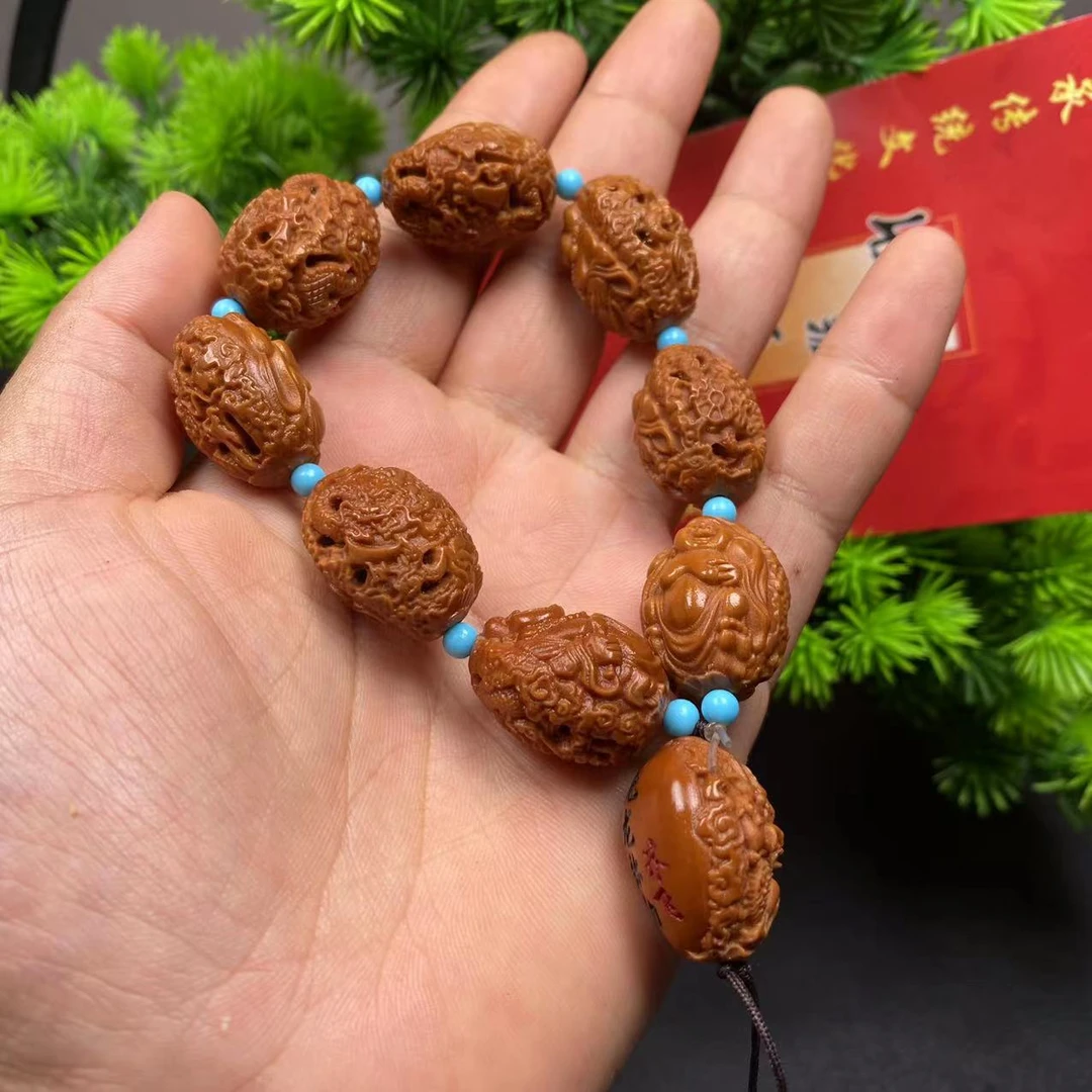 橄榄核核雕手串宋伟九龙弥勒   证书