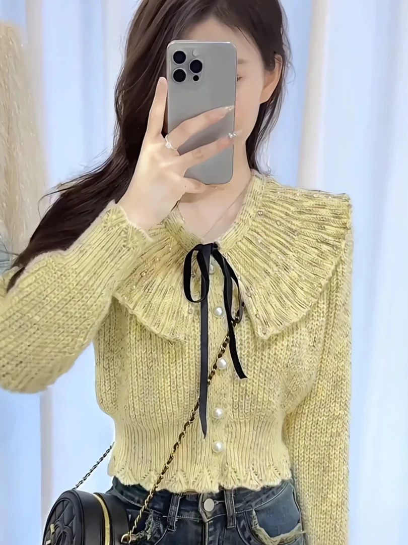 娃娃领珍珠扣长袖针织开衫女新款蝴蝶结甜美修身短款上衣