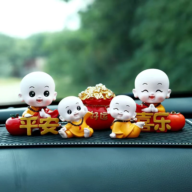 车载摆件摇头可爱小和尚高档车内装饰品创意香薰汽车中控台摆件