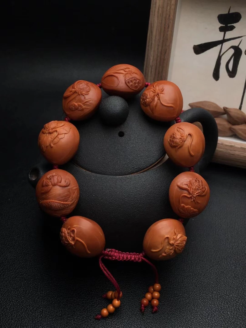 苏工橄榄核雕荷韵2.0*2.1的，铁核雕刻颜色红润密度高，低价引流