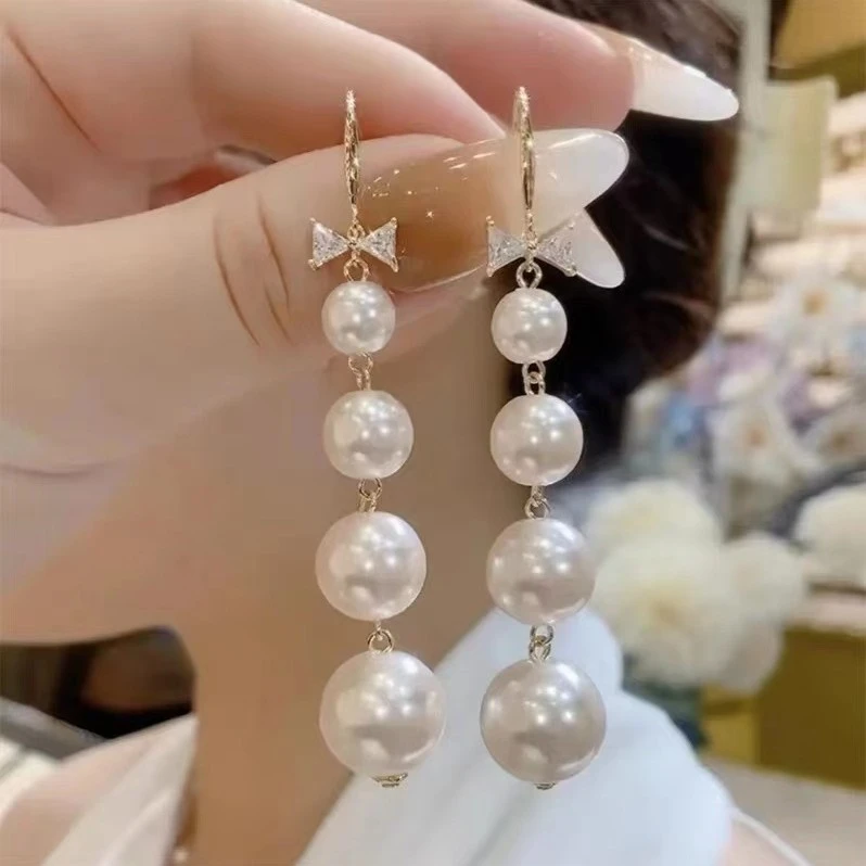 合金耳饰 新款气质长款蝴蝶结珠珠小众设计轻奢简约百搭耳环C531