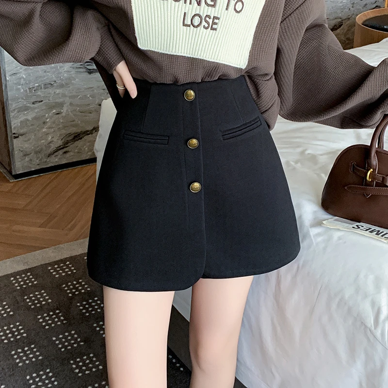 不规则半身裙裤女春季新款高腰显瘦咖色排扣a字短裙遮胯包臀裙子