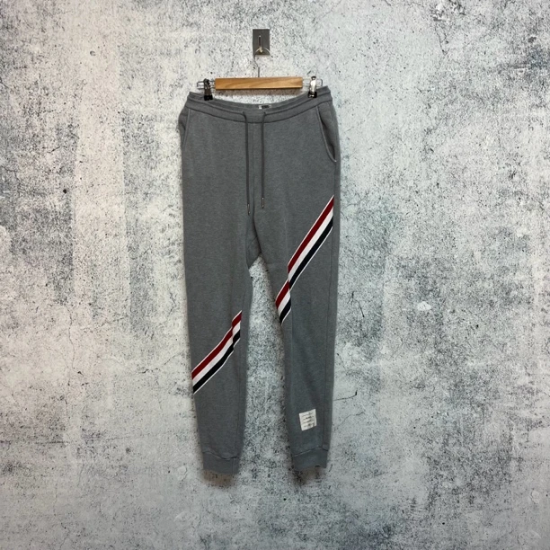 全新未使用 / Thom Browne/tb 灰色四条纹束脚长裤/ 0码 /2114