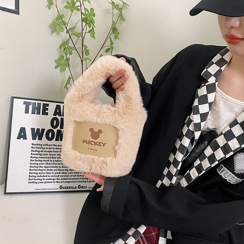 米奇毛绒手提包化妆包毛绒绒秋冬新款包包零钱网红手机手提水桶包