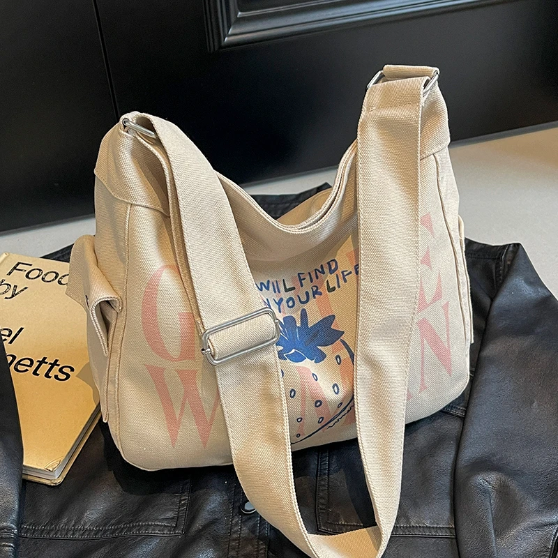 通勤轻便休闲帆布包女大容量纯色斜挎包女百搭韩版小众包包饺子包