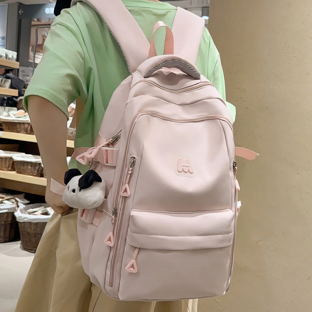 书包初中女生高颜值大容量减负护脊背包高中生小学生简约双肩包女