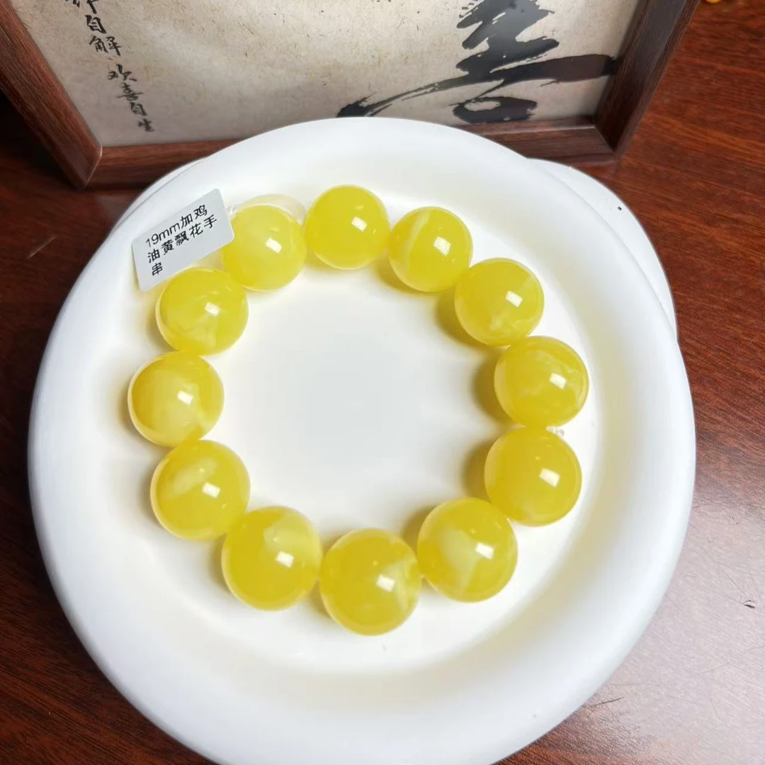 W011古巴新蜜鸡油黄飘花手串19mm