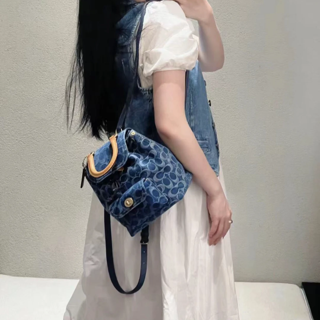 99新 COACH/蔻驰 蓝色单宁老花双肩包