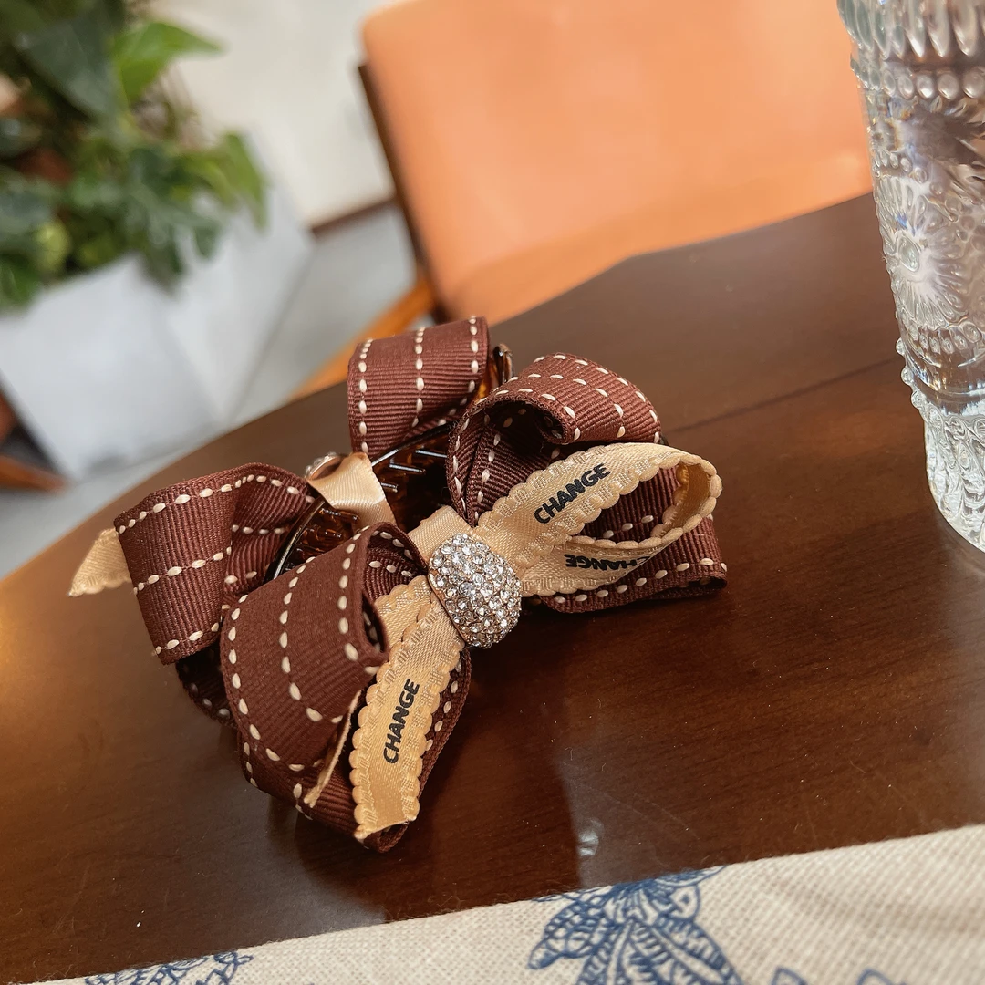 6678复古蝴蝶结丸子抓