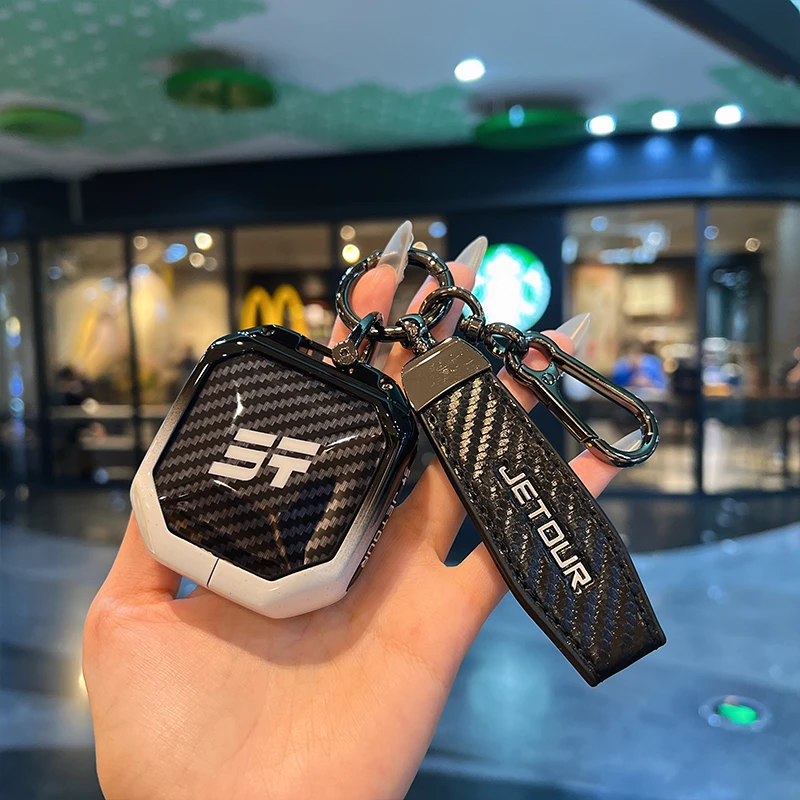 适用于新款捷途旅行者钥匙套奇瑞捷途山海t2碳纤纹渐变金属壳包扣