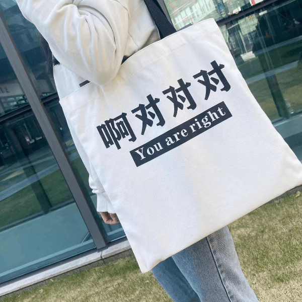 骆驼帆布包时尚休闲白色百搭夏季女生单肩包运动挎包简约手拎包