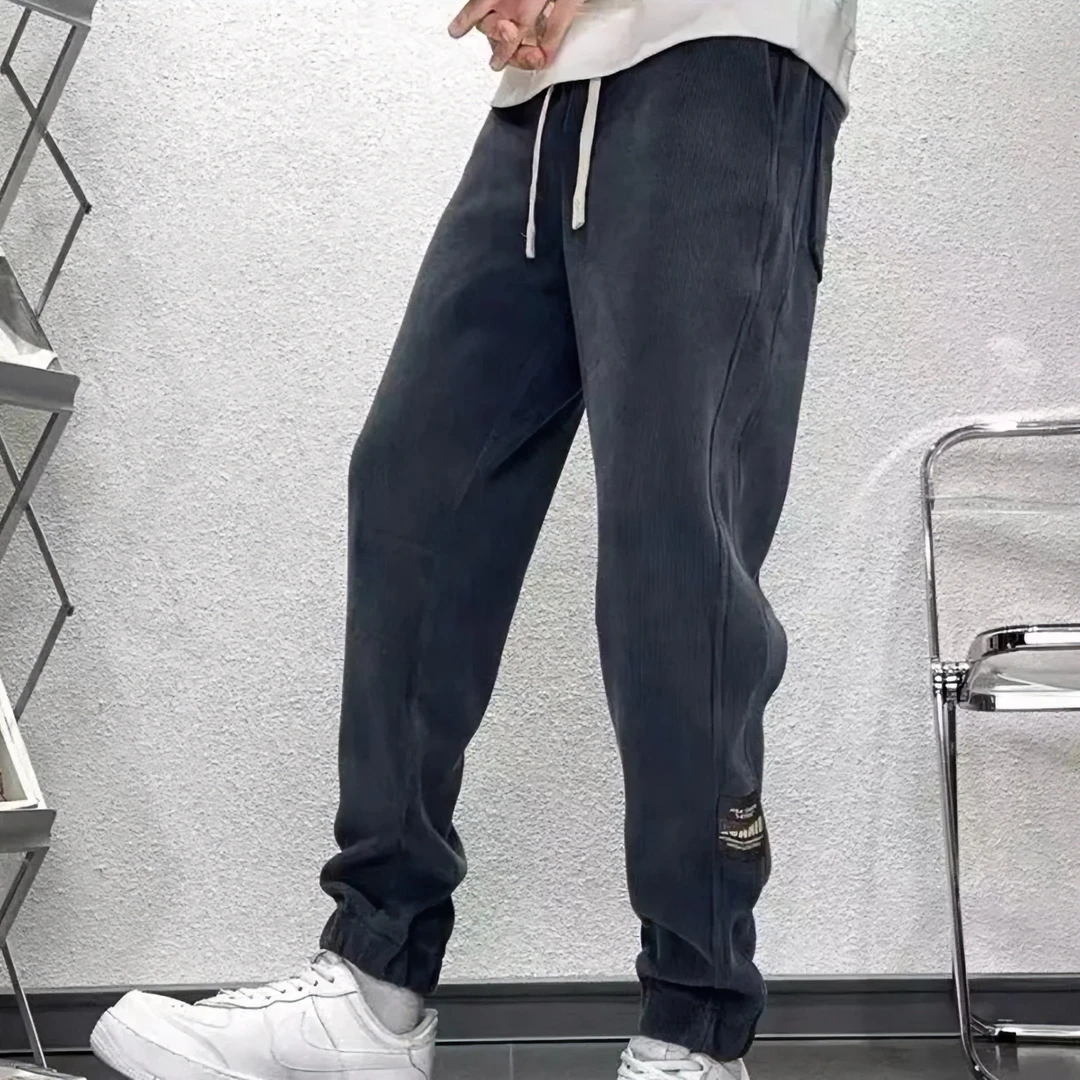 秋冬季新款男士加厚加绒休闲卫裤时尚简约百搭束脚宽松拼接长裤