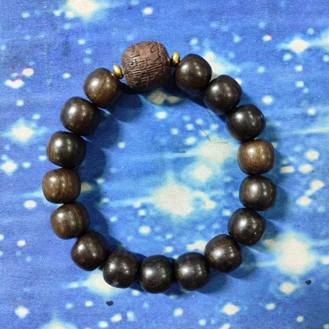 W4 黑柿木1.2桶珠带雕刻手串