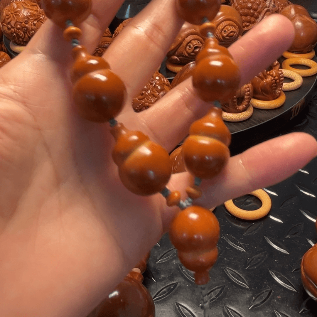 橄榄核核雕因****?葫芦一条