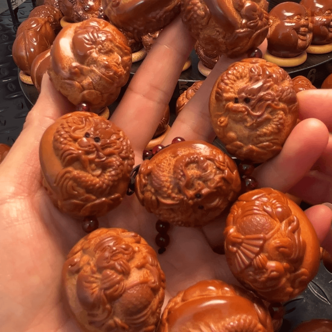橄榄核核雕欧**纸龙财一条