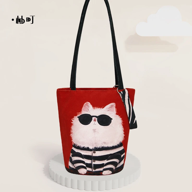 柚町x墨镜叮珰卡通文艺大容量通勤水桶包个性简约帆布包女