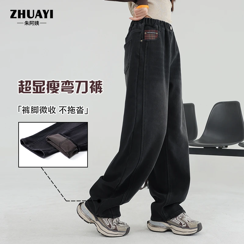 女大童加绒裤子秋冬新款腰畔金属字母牛仔裤黑色显瘦弯刀休闲裤