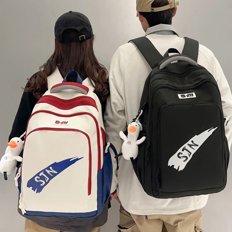 减负护脊新款初中生书包男大容量大学生高中防水背包小学生双肩包