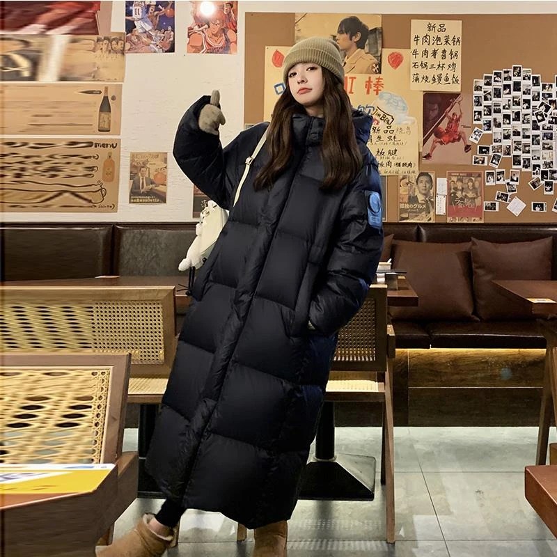 黑金鹅绒羽绒服女冬季2025新款韩版过膝保暖东北加厚宽松长款外套