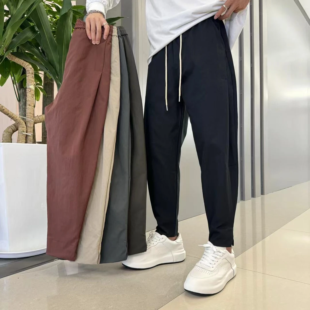 7712早秋复古时尚显瘦弯刀裤开叉男士休闲裤纯色松紧腰百搭哈伦裤