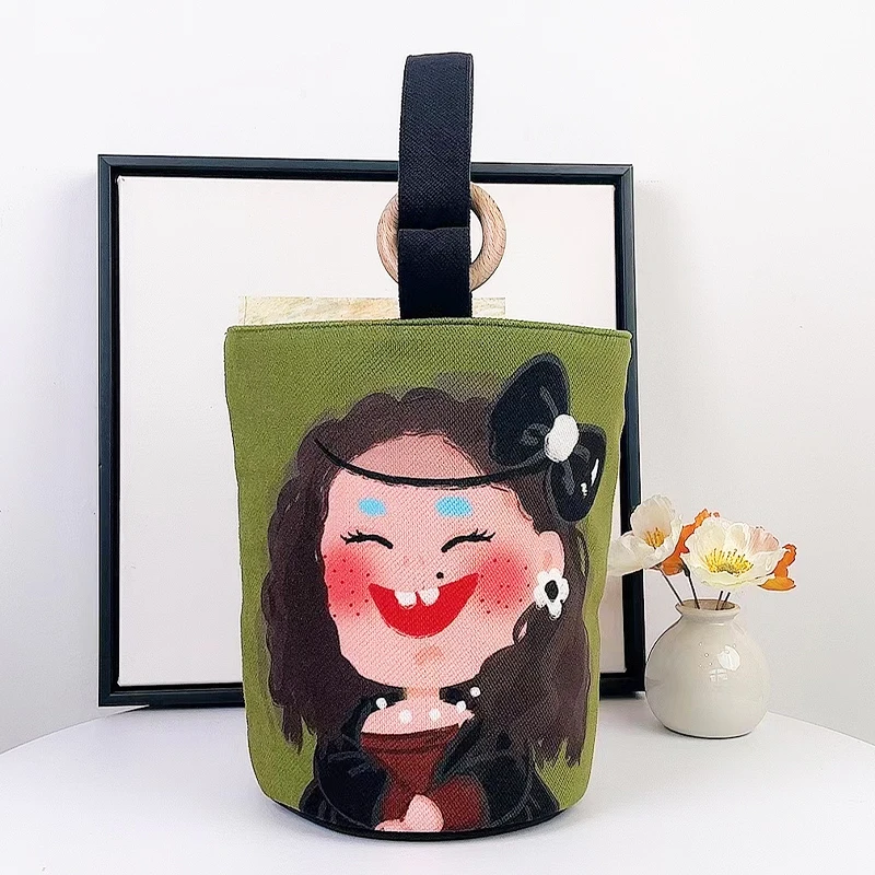 弘娜X仟精灵 原创名画卡通表情休闲水桶包女手提包包单肩通用布包