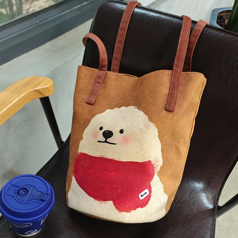 嘉哥新款可爱围脖小狗细肩带水桶包通勤大容量单肩包女