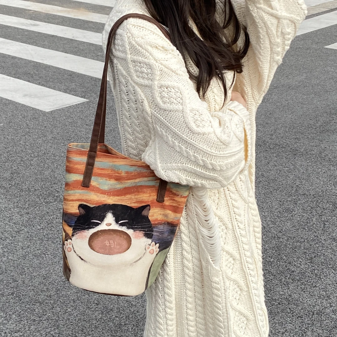 弘娜×一点心意 原创复古妈宝小猫手提单肩水桶包印花斜挎女休闲包