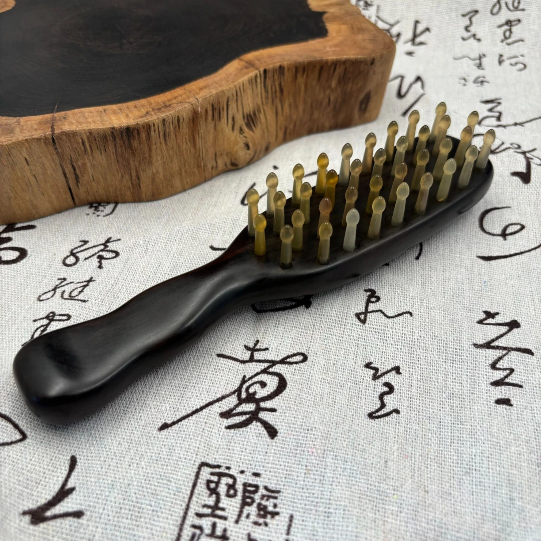 紫光檀荷花钉按摩梳羊角梳齿曲柄家用梳头经络疏通防脱梳子