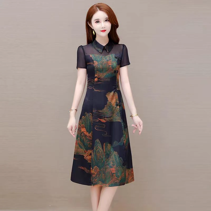 X963 气质女装连衣裙2024夏季新款时尚轻奢洋气盘扣网纱拼接A字裙