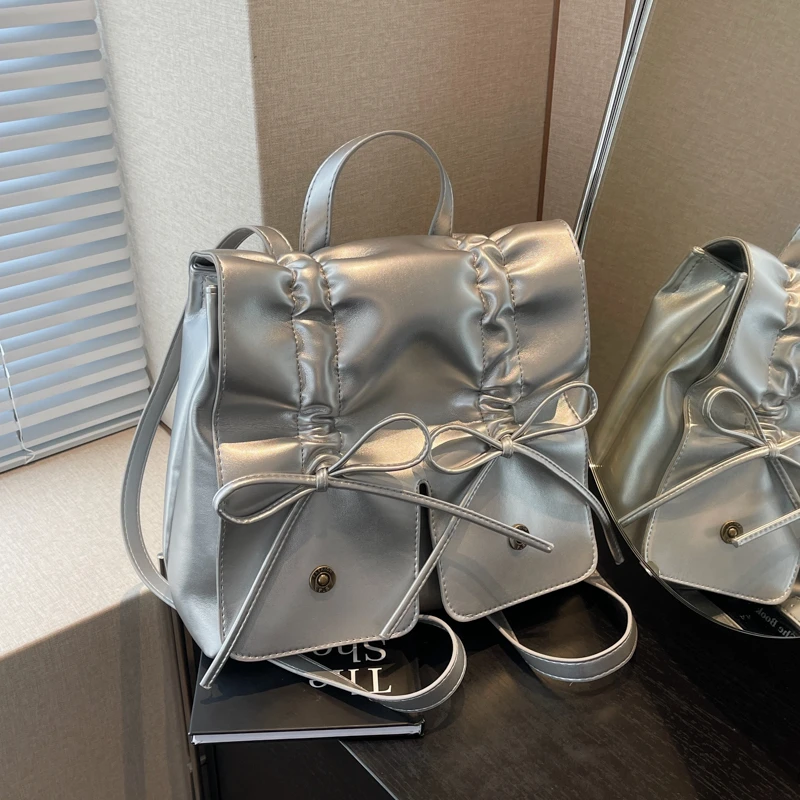 甜美褶皱蝴蝶结双肩包包小众新款韩式时尚双肩背包休闲银色双肩包