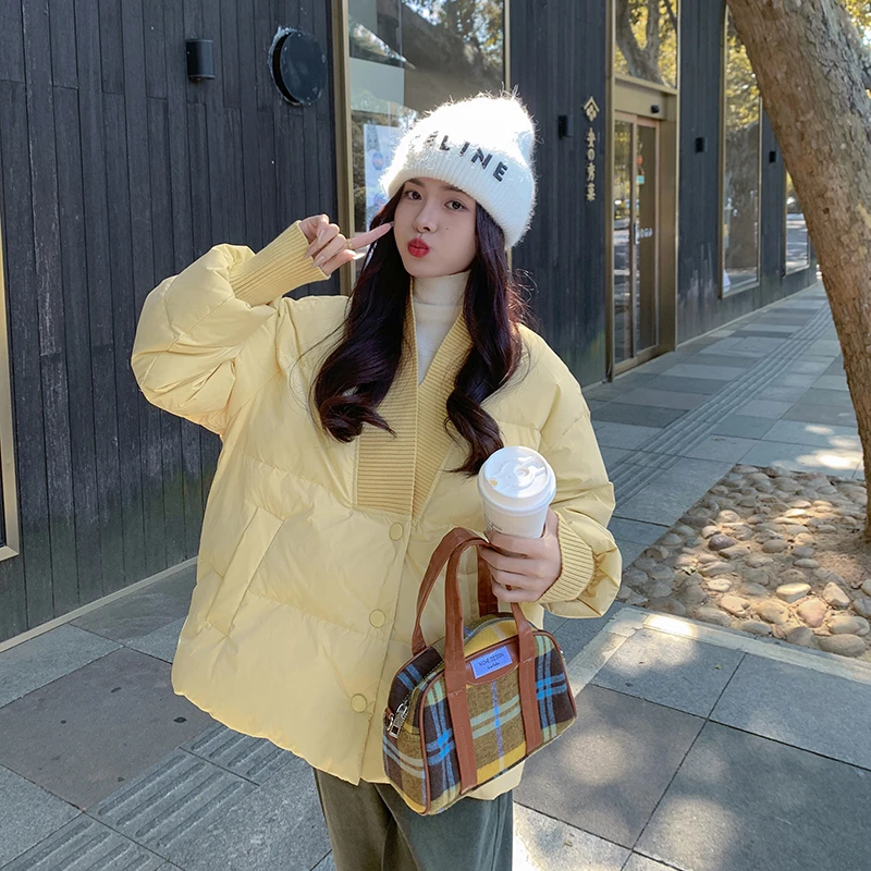 奶黄色羽绒服女2025冬季韩系穿搭新款设计感超好看保暖白鸭绒外套