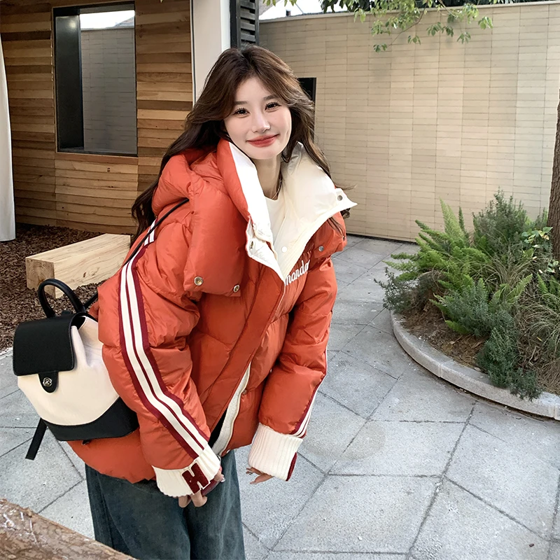桔红色撞色学院风羽绒服女冬季2024新款连帽独特高级感短款面包服